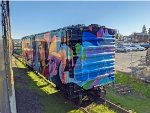 Closer view of the mural on an old boxcar as our train heads back into town